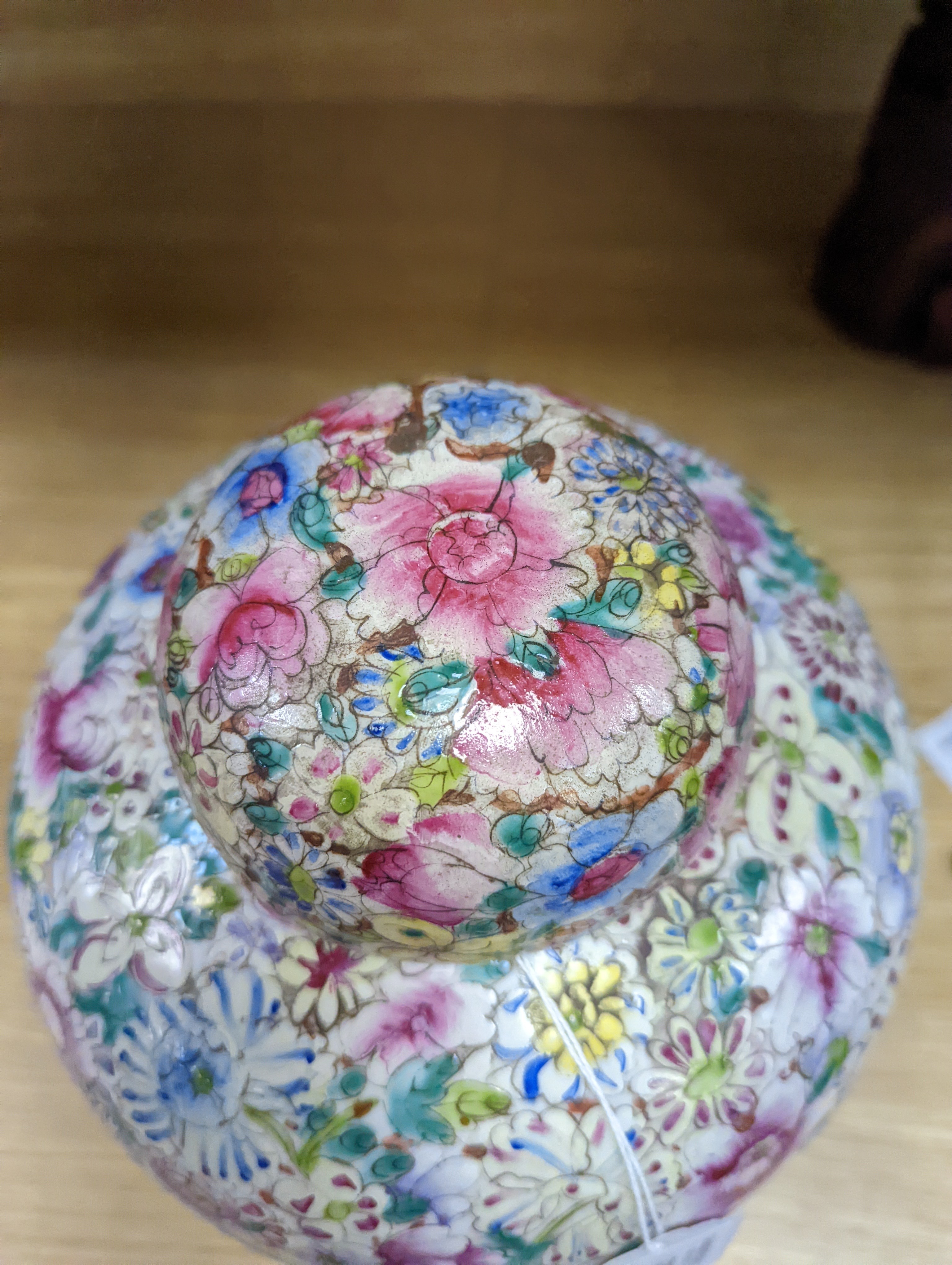 A Chinese thousand flower famille rose jar and cover, early 20th century, wood stand 28cm